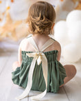 Load image into Gallery viewer, mace and co kids clothing dubai, romper with long bow back in linen material and khaki green colour. Girls ages up to seven years old, including infant and toddler. Perfect for playtime, birthday parties and formal events.