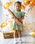 Load image into Gallery viewer, mace and co dubai kids linen material dress in mint green colour, open back design with frill sleeve, for girls, perfect for casual wear, special occasions and parties.
