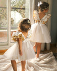 Load image into Gallery viewer, mace and co kids clothing dubai, white and gold colour tulle dress, for girls from infant, toddler and up to seven years old. Perfect for birthday parties, special occasions and formal events.