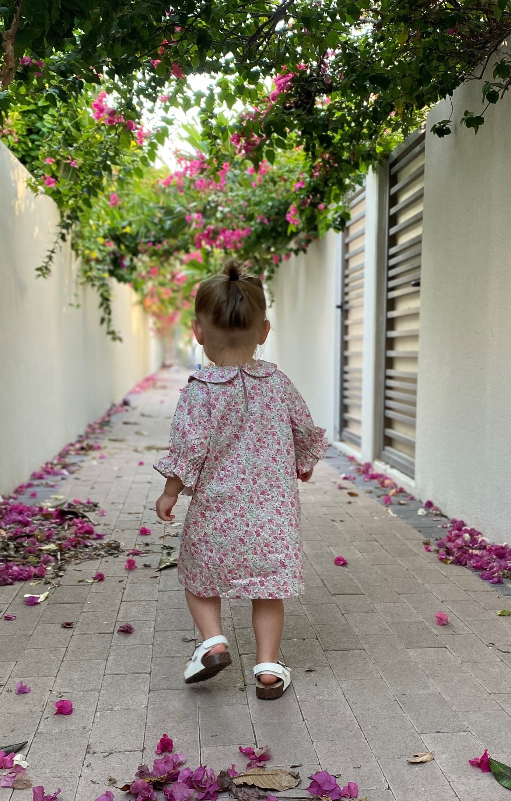 Mace and co Kids Dubai Cotton Floral Dress for girls up to ages 7, back view. Limited edition, perfect for parties, playdates and special occasions