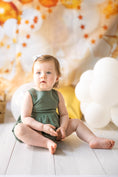 Load image into Gallery viewer, mace and co kids clothing dubai, romper with long bow back in linen material and khaki green colour. Girls ages up to seven years old, including infant and toddler. Perfect for playtime, birthday parties and formal events.
