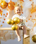 Load image into Gallery viewer, mace and co kids clothing dubai, romper in sand beige colour, with long sleeves and bow on the front, outfit for girls ages infant, toddler up to seven years old. Perfect for specials occasions, birthday parties and playtime.
